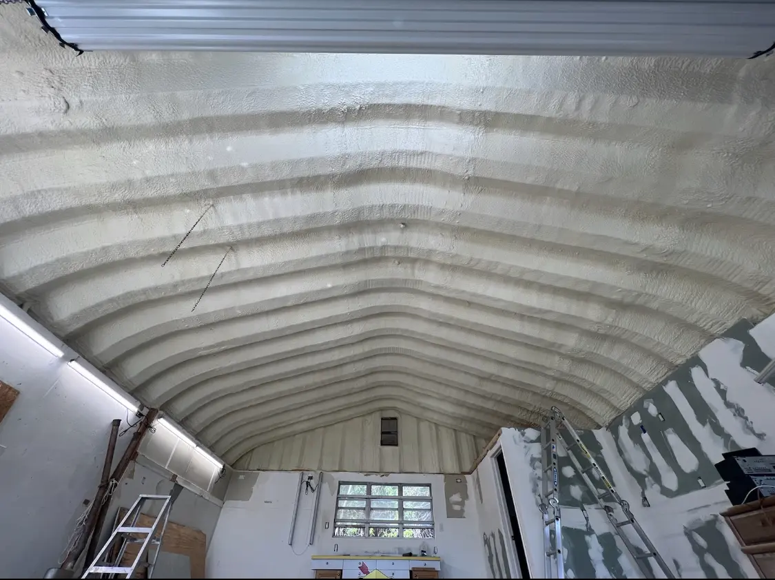 Spray polyurethane foam applied to the underside of a metal roof deck in Collegedale